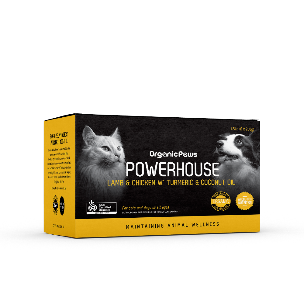 Powerhouse Lamb & Chicken organic pet food box with cat and dog images, turmeric and coconut oil ingredients, maintaining animal wellness