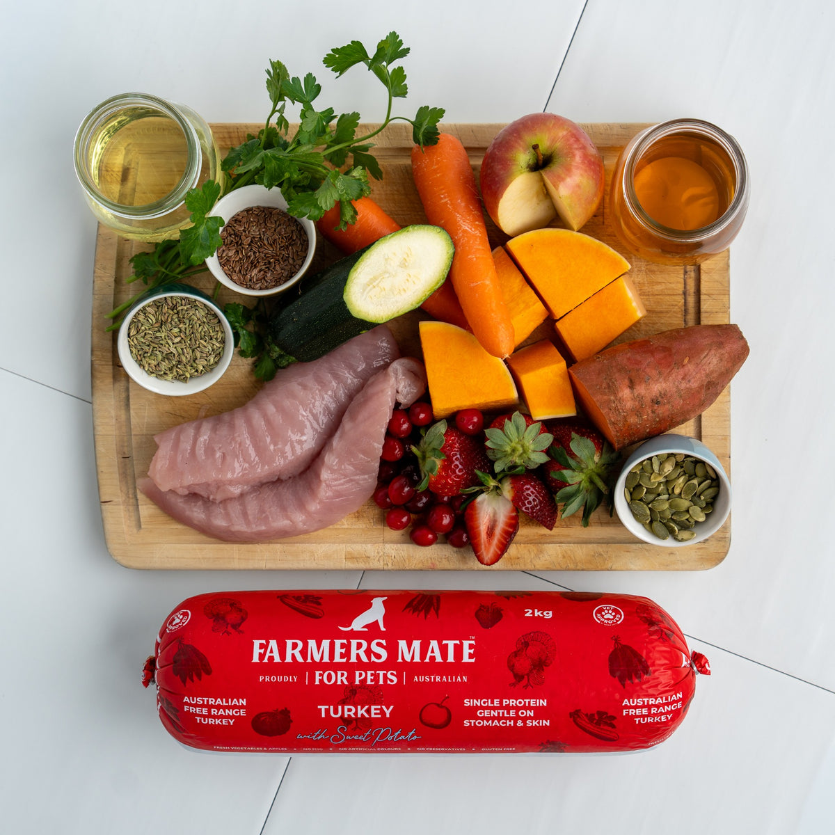 2KG Turkey ROLL on a board with fresh sweet potato, zucchini, pumpkin, carrot and cranberries